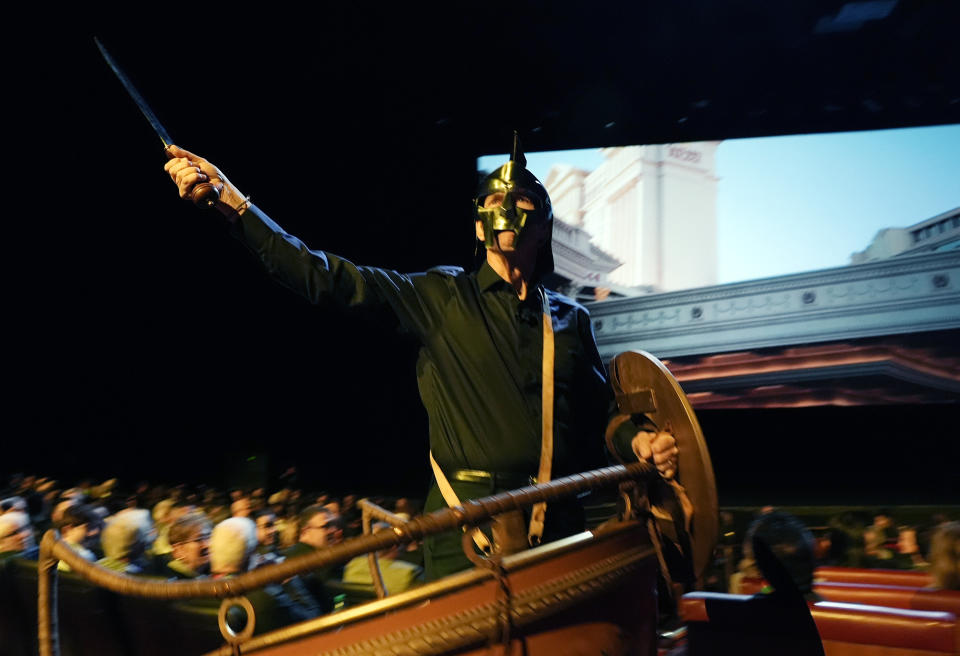 Chris Aronson, president of domestic theatrical distribution for Paramount Pictures, arrives via chariot to the Paramount Pictures presentation at CinemaCon 2024, Thursday, April 11, 2024, at Caesars Palace in Las Vegas. The studio is releasing "Gladiator 2" later in the year. (AP Photo/Chris Pizzello)