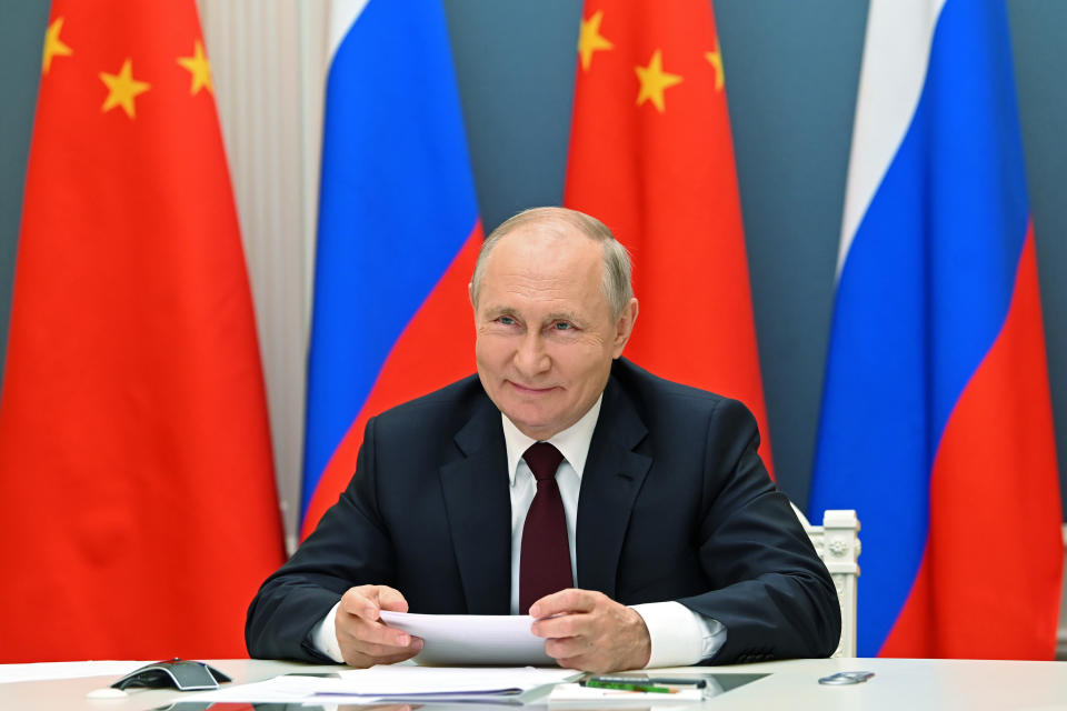 FILE - In this June 28, 2021, file photo, Russian President Vladimir Putin talks with Chinese President Xi Jinping via video conference in Moscow, Russia. U.S. President Joe Biden, his Chinese counterpart Xi Jinping, Japanese Prime Minister Yoshihide Suga and Russian President Vladimir Putin are among Pacific Rim leaders gathering for a virtual meeting on Friday, July 16, 2021, to discuss strategies to help economies rebound from a resurgent COVID-19 pandemic. (Alexei Nikolsky, Sputnik, Kremlin Pool Photo via AP, File)