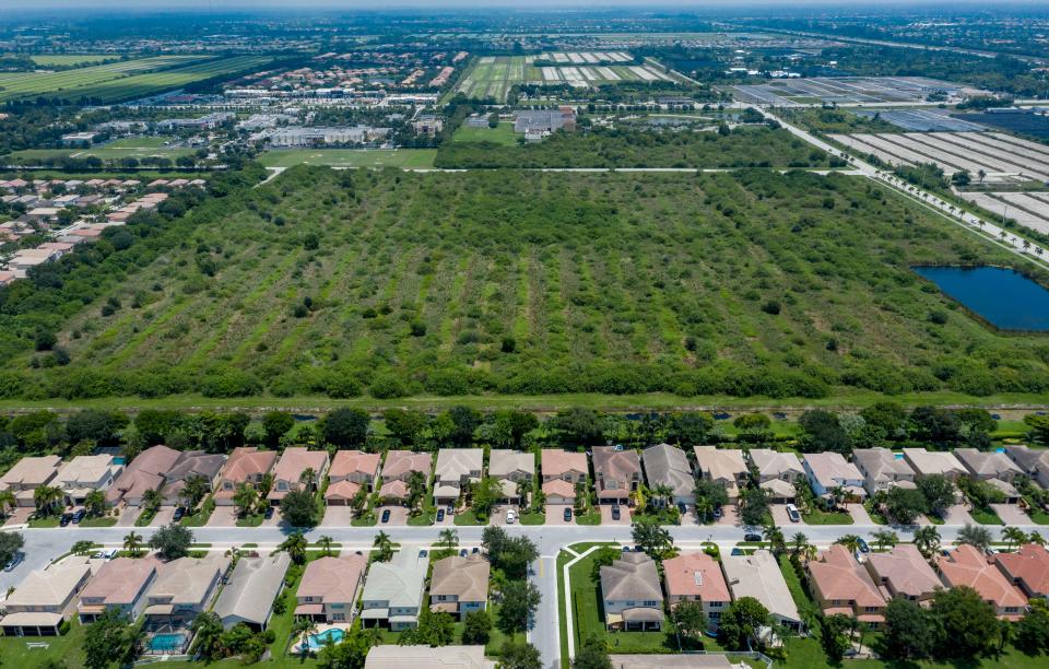 The Canyon Lakes development, bottom, next to a 39-acre site at the southeast corner of Boynton Beach Boulevard and Acme Dairy Road, top. The builder, a Boca Raton-based trust, wants the county to create a new Agricultural Reserve multiple land use category to enable it to erect 432 workforce housing units and 261,300 square feet of commercial space including light industrial, a theater and a hotel west of Boynton Beach, Florida, June 10, 2020.