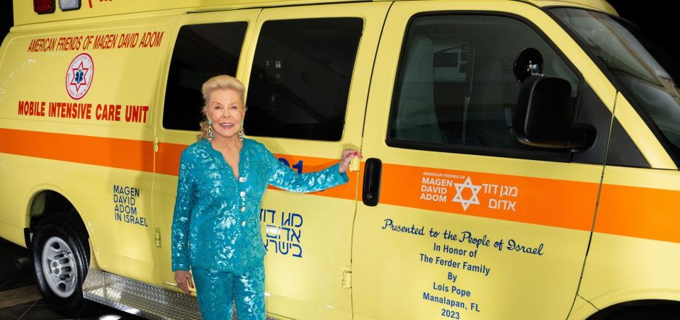 Lois Pope with her latest ambulance gift to MDA.jpeg