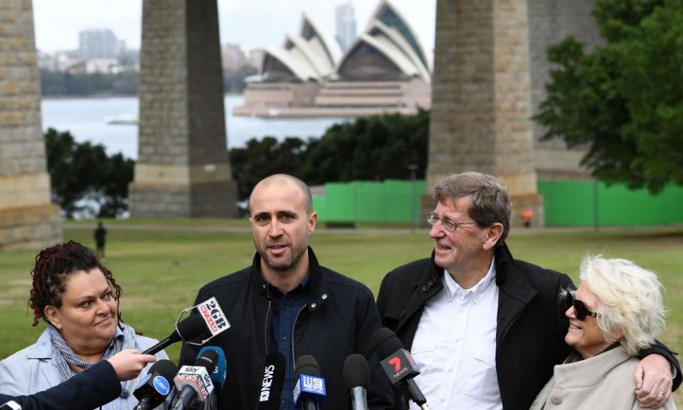 Bim Ricketson (second left), the nephew of Australian film-maker James Ricketson, attends a press conference with Ricketson’s daughter Roxane Holmes (left) and brother Peter Ricketson (second right) in Sydney on Monday.