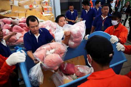 FILE PHOTO: Thai narcotics officials put bags of methamphetamine pills into a bin during the 48th Destruction of Confiscated Narcotics ceremony in Ayutthaya province, Thailand, June 25, 2018. REUTERS/Athit Perawongmetha/Files