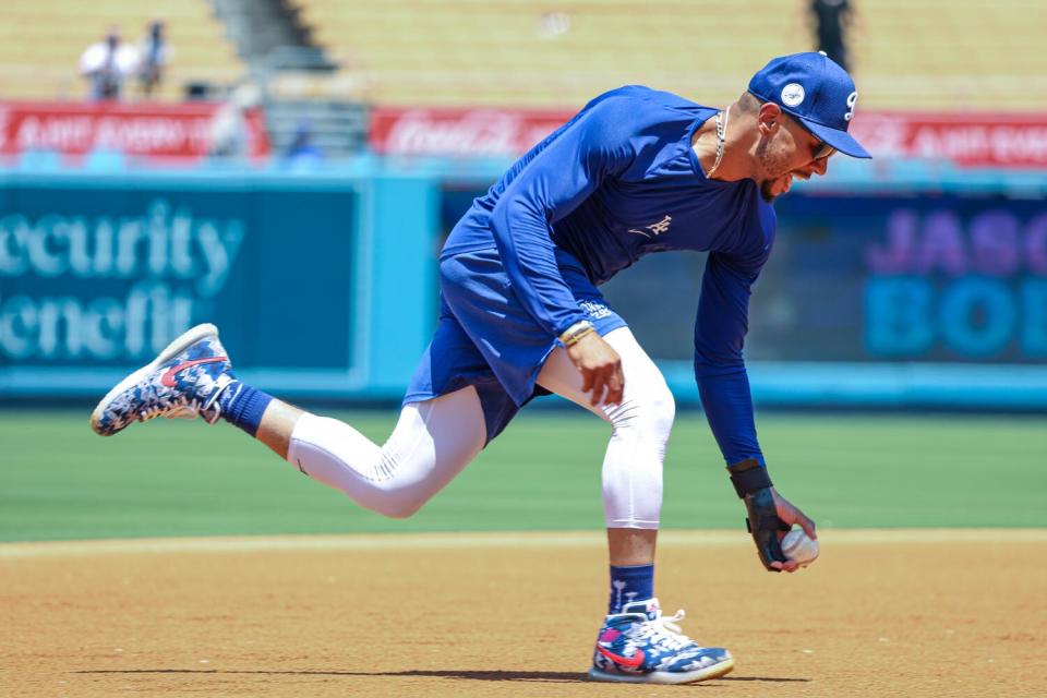 Mookie Betts undergoes rehab exercises before a game against the Milwaukee Brewers in July at Dodger Stadium.