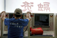 An investor monitors stock prices at a brokerage house in Beijing, Thursday, June 27, 2019. Asian stocks advanced Thursday ahead of a meeting between U.S. President Donald Trump and Chinese leader Xi Jinping at the G-20 summit in Japan this week. (AP Photo/Andy Wong)