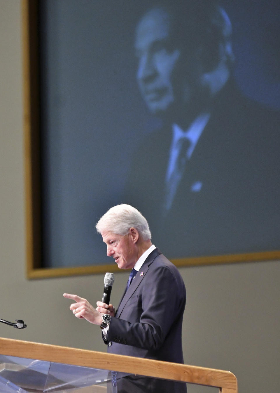 Former U.S. President Bill Clinton speaks at the funeral of Congressman John Conyers Jr. at Greater Grace Temple in Detroit on Monday, Nov. 4, 2019. (Robin Buckson/Detroit News via AP)