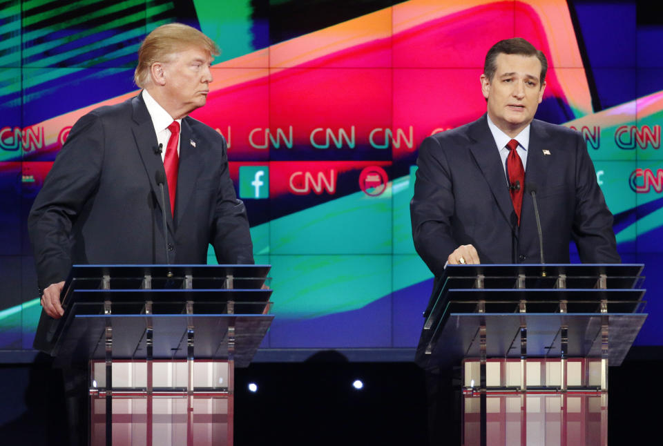 Sen. Ted Cruz speaks as Donald Trump listens during the CNN Republican presidential debate on Dec. 15, 2015, in Las Vegas. (Photo: John Locher/AP)