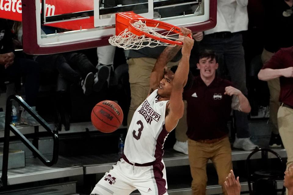 Mississippi State guard Shakeel Moore dunks during the second half of the team's NCAA college basketball game against Auburn in Starkville, Miss., Wednesday, March 2, 2022. Auburn won 81-68. (AP Photo/Rogelio V. Solis)