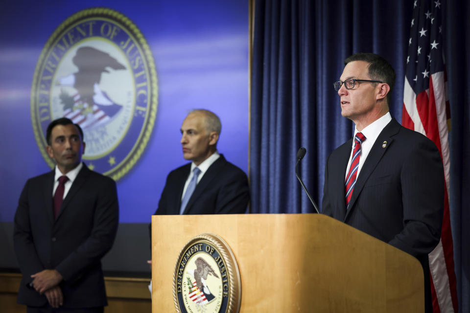 U.S. Attorney Randy S. Grossman for the Southern District of California, right, speaks during a press conference at the U.S. Attorney's Office for the Southern District of California Thursday, Aug. 3, 2023 in San Diego. Two U.S. Navy sailors have been arrested and accused of providing sensitive military information to China — including details on wartime exercises, Naval operations and critical technical material, federal officials said Thursday. (Meg McLaughlin/The San Diego Union-Tribune via AP)