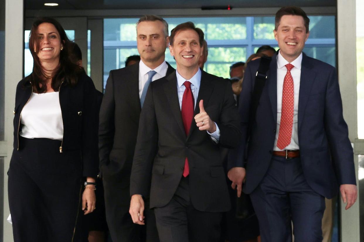 Dominion Voting Systems CEO John Poulos, second from left, with members of his legal team leaving the courthouse after a settlement with Fox News on April 18, 2023, in Wilmington, Del. <a href="https://www.gettyimages.com/detail/news-photo/dominion-voting-systems-ceo-john-poulos-leaves-with-members-news-photo/1483133428?adppopup=true" rel="nofollow noopener" target="_blank" data-ylk="slk:Alex Wong/Getty Images;elm:context_link;itc:0;sec:content-canvas" class="link ">Alex Wong/Getty Images</a>