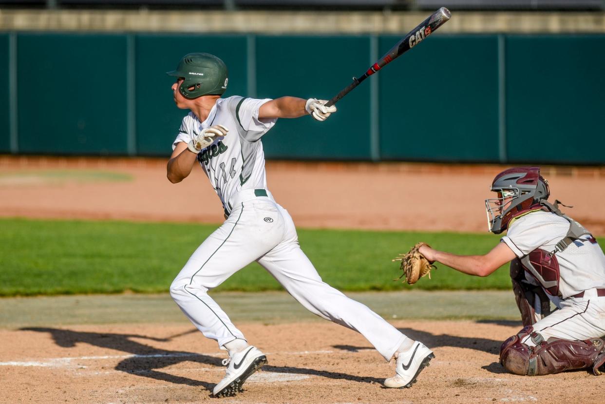 Olivet's Lalo Aguirre gets on base during the ninth inning in the game against Okemos on Wednesday, May 31, 2023, at McLane Stadium on the Michigan State campus in East Lansing.