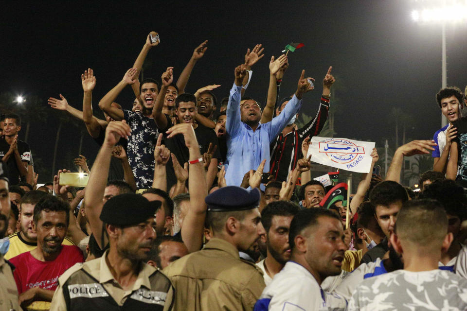 Hundreds of demonstrators protest in Tripoli, Libya, on Friday, Sept. 24, 2021, in opposition to the country’s parliament passing a vote of no-confidence in the transitional government. The motion, passed on Tuesday, represents a challenge to planned December elections and impedes efforts to unite the oil-rich North African nation after a decade of turmoil. (AP Photo/Yousef Murad)