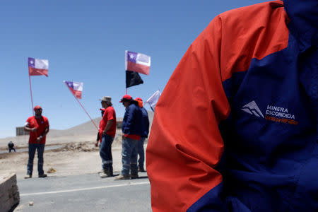 Workers from BHP Billiton's Escondida, the world's biggest copper mine, gather outside the company gates during a strike, in Antofagasta, Chile February 10, 2017. REUTERS/Juan Ricardo