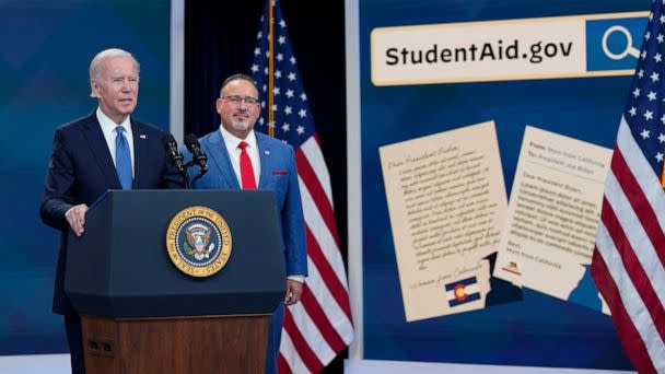 PHOTO: President Joe Biden speaks about the student debt relief portal beta test as Education Secretary Miguel Cardona listens in the South Court Auditorium on the White House complex in Washington, Oct. 17, 2022. (Susan Walsh/AP)