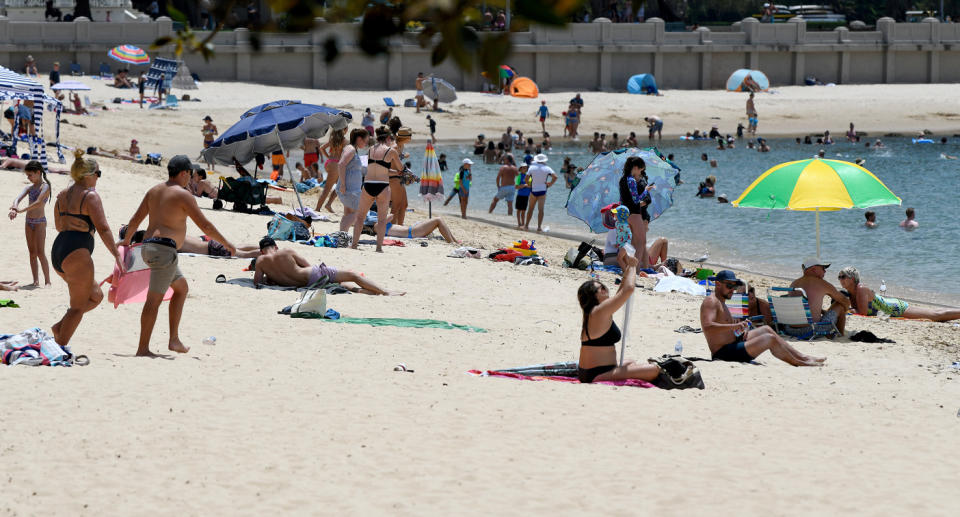 Sydney's Balmoral Beach crowded with people.