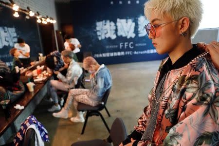 Members of China's all-girl "boyband" FFC-Acrush prepare for band's maiden press conference in Beijing, China April 28, 2017. REUTERS/Damir Sagolj/Files