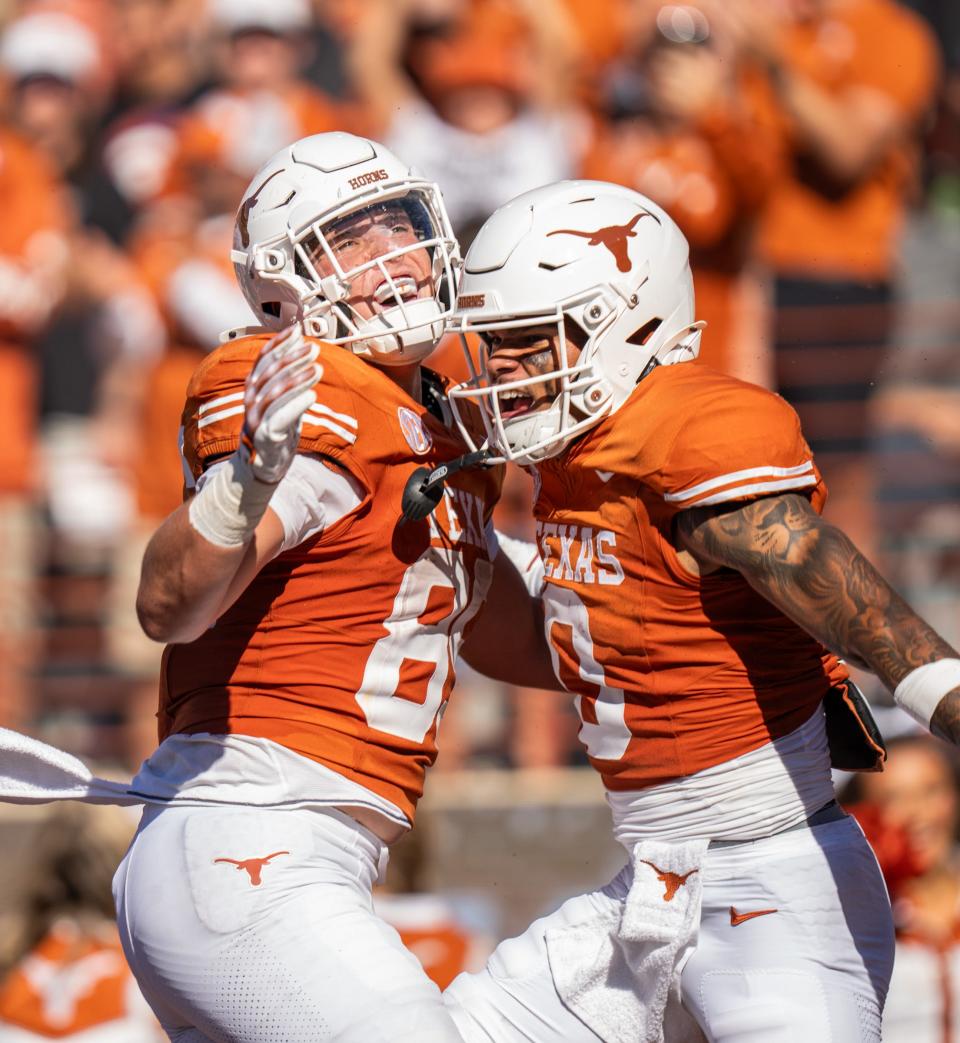 Texas wide receiver DeAndre Moore Jr., right, celebrates his touchdown catch with wide receiver Ty Boatright during last week's win over Mississippi State at Royal-Memorial Stadium. The Longhorns are 5-0 entering the bye week and play Oklahoma next week.