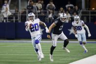 Dallas Cowboys running back Tony Pollard (20) gets past Las Vegas Raiders place kicker Daniel Carlson (2) as Pollard returns a kickoff for a touchdown in the second half of an NFL football game in Arlington, Texas, Thursday, Nov. 25, 2021. (AP Photo/Ron Jenkins)