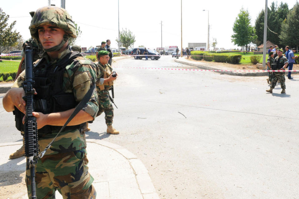 Lebanese army soldiers secure the area at the site of a bomb blast