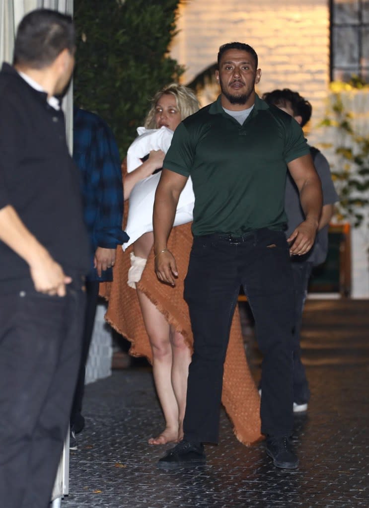 Spears wrote that she “twisted” her ankle at the hotel. BACKGRID