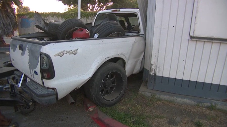 A violent hit-and-run crash involving two trucks caused heavy damage to a gas station car wash in Harbor Gateway on July 16, 2024. (KTLA)