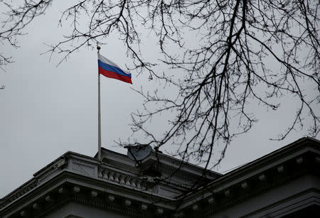 FILE PHOTO: A Russian flag flies atop the Consulate General of the Russian Federation in Seattle, Washington, U.S., March 26, 2018. REUTERS/Lindsey Wasson/File Photo