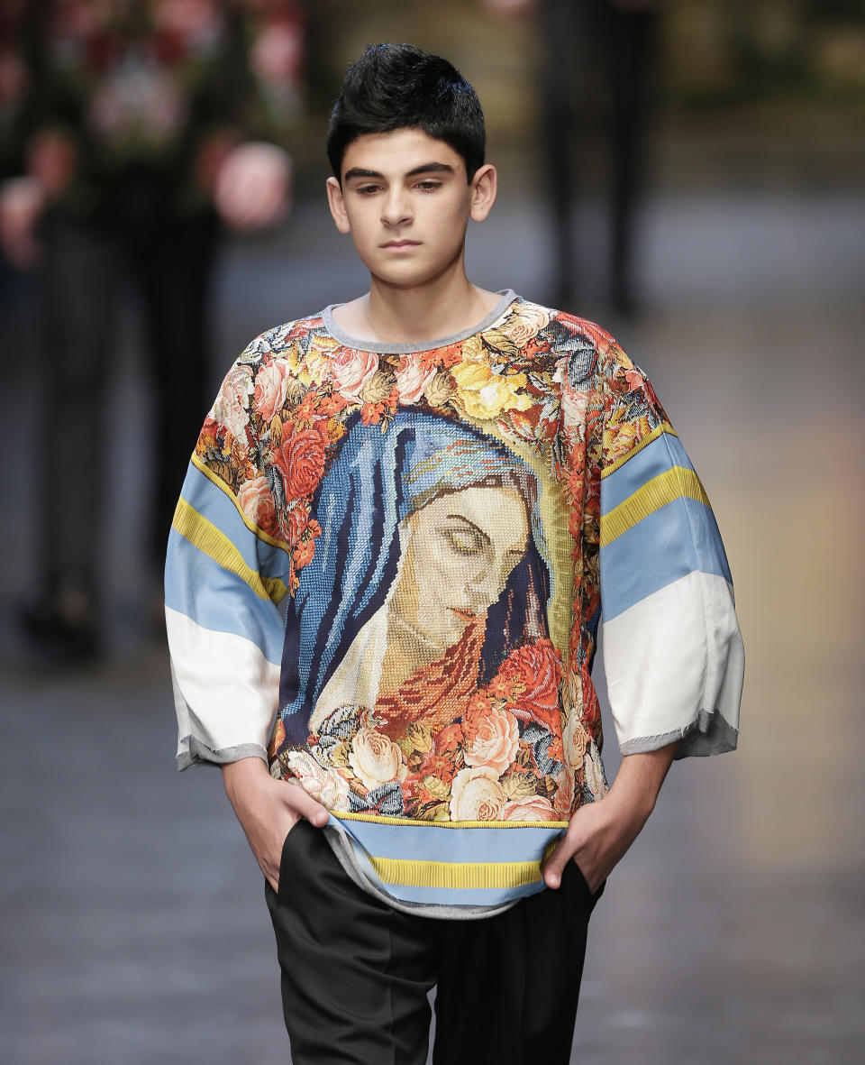 A model wears a creation of Dolce & Gabbana men's Fall-Winter 2013-14 collection, part of the Milan Fashion Week, unveiled in Milan, Italy, Saturday, Jan. 12, 2013. (AP Photo/Antonio Calanni)