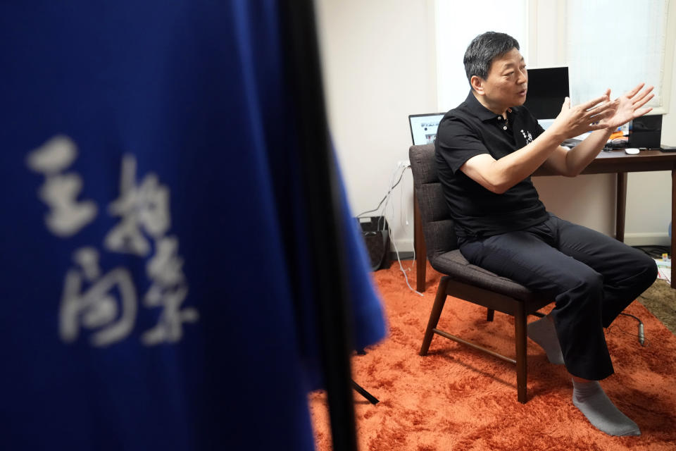 Wang Zhi'an speaks during an interview with the Associated Press in Tokyo on Oct. 5, 2022. Chinese investigative journalist Wang once exposed corruption, land seizures, and medical malpractice for state broadcaster CCTV. Today, he's in exile in Japan, and starting again as an independent journalist on YouTube. (AP Photo/Eugene Hoshiko)