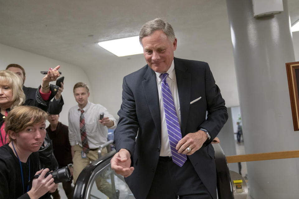 Senate Intelligence Committee Chairman Richard Burr, R-N.C., heads to the Senate as reporters ask about reports that his panel's investigation has found no direct evidence of a conspiracy between President Donald Trump's campaign and Russia, at the Capitol in Washington, Tuesday, Feb. 12, 2019. (AP Photo/J. Scott Applewhite)