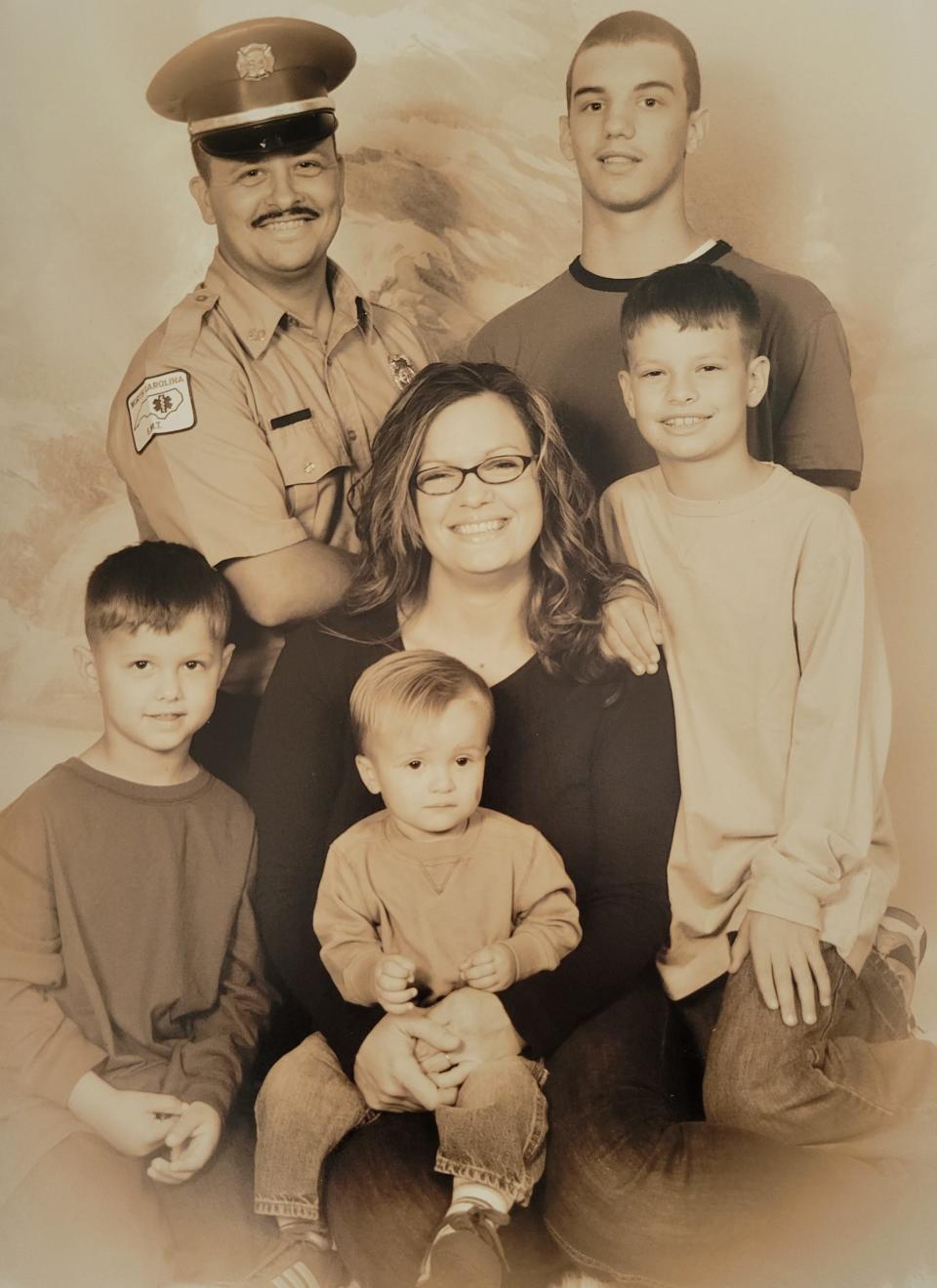 U.S. Army Sergeant Roger Leeroy Adams Jr. and his wife Teresa with their four sons.
