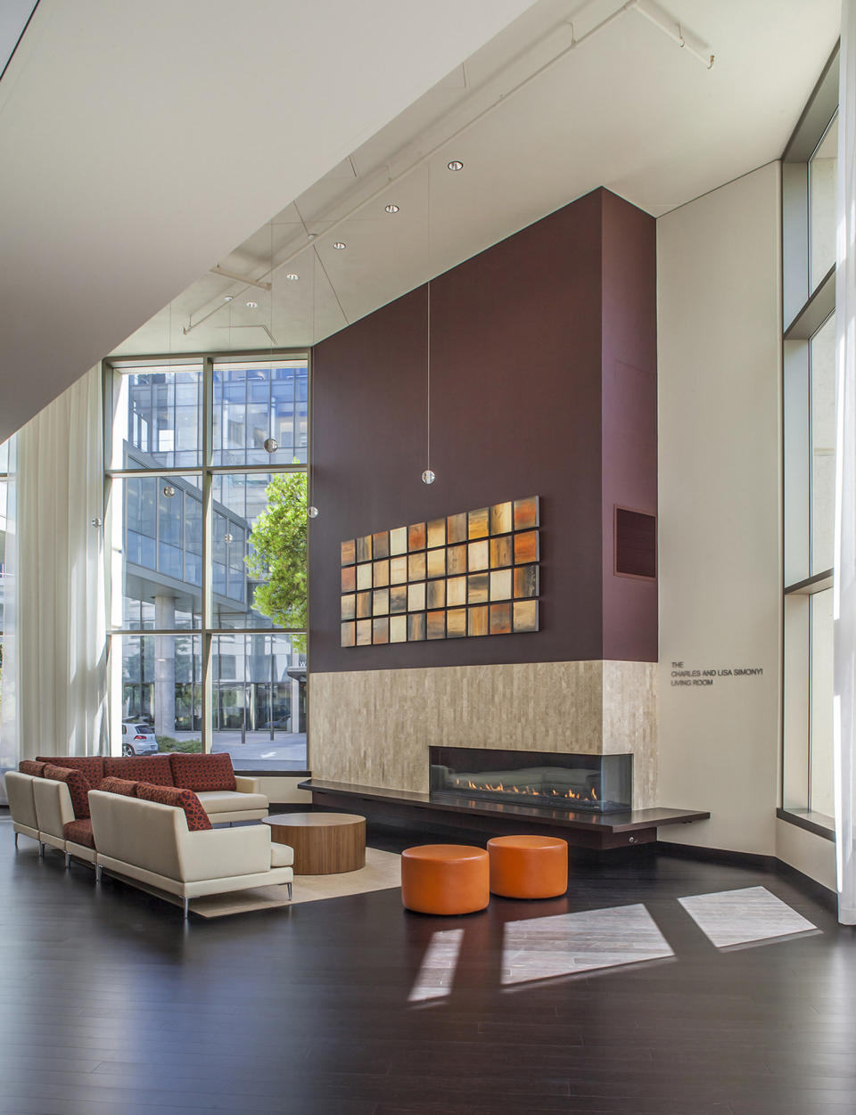 This undated photo provided by Perkns+Will shows the Lytle Center at Swedish First Hill Medical Center in Seattle, where a cozy fireplace welcomes visitors. (Eckert and Eckert Photography/Perkins+Will via AP)