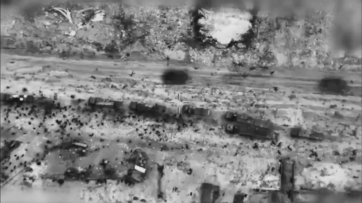 IDF video released Feb. 29 shows bodies lying on the ground between what appear to be aid trucks and IDF tanks. (IDF)