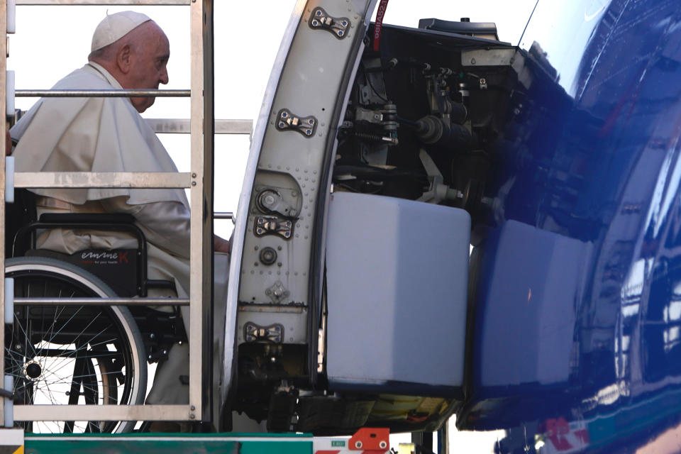 Pope Francis arrives at Rome's Leonardo da Vinci International airport in Fiumicino to start his three-day trip to Kazakhstan, Tuesday, Sept. 13, 2022. (AP Photo/Domenico Stinellis)