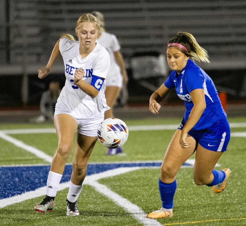 Berlin Brothersvalley's Ashley Brant, left, and Windber's Nici Costlow give chase to a loose ball during a District 5 Class 1A girls soccer quarterfinal, Oct. 25, in Windber.