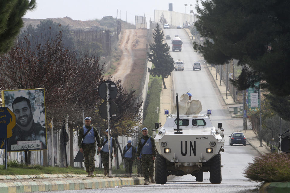 Serbian U.N peacekeepers patrol the Lebanese side of the Lebanese-Israeli border in the southern village of Kfar Kila, Lebanon, Tuesday, Dec. 4, 2018. The Israeli military launched an operation on Tuesday to "expose and thwart" tunnels it says were built by the Hezbollah militant group that stretch from Lebanon into northern Israel. (AP Photo/Mohammed Zaatari)