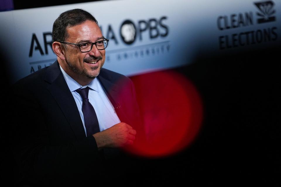 Adrian Fontes prepares before a debate with Reginald Bolding as they compete for the Democratic nomination for secretary of state on Wednesday, April 20, 2022, in Phoenix.