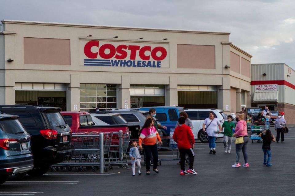 Customers head to their vehicles with their purchases recently at Costco in Kennewick. Rumors are swirling on social media and around the Tri-Cities that a Costco will be building a new Pasco store.