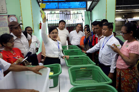 An Union Election Commission staff counts votes at a polling station during for the by-election in Yangon, Myanmar, November 3, 2018. REUTERS/Ann Wang