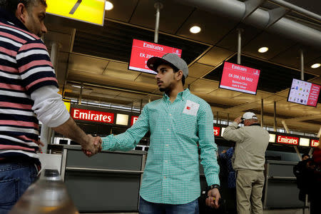 Family members say good bye at an Emirates Airlines ticket desk at JFK International Airport in New York, U.S., March 21, 2017. REUTERS/Lucas Jackson