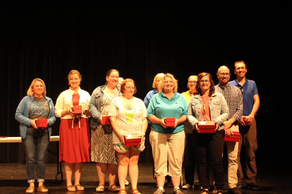 Perry Schools staff members receive 15 years of service awards during a presentation on Wednesday, May 31, 2023.