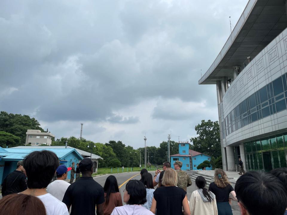 U.S. Private Travis T. King (wearing a black shirt and black cap) is seen in this picture taken during a tour of the tightly controlled Joint Security Area (JSA) on the border between the two Koreas, at the truce village of Panmunjom, South Korea, July 18, 2023 (REUTERS)