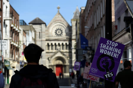 A man walks past a pro-choice poster ahead of a 25th May referendum on abortion law, in Dublin, Ireland May 22, 2018. REUTERS/Clodagh Kilcoyne