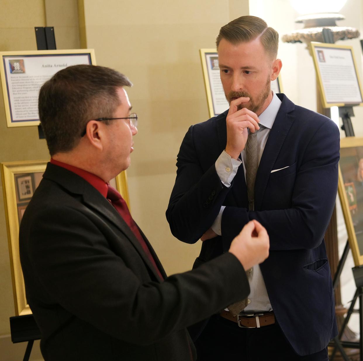 Before and after his election as state schools superintendent, Ryan Walters, right, has been involved in an education coalition pushing for school vouchers.