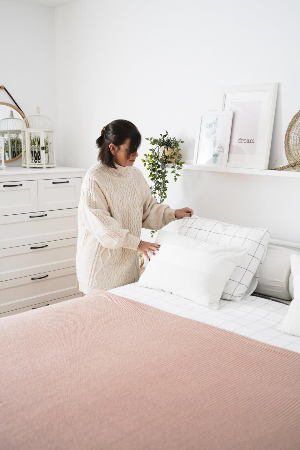 Woman making her bed