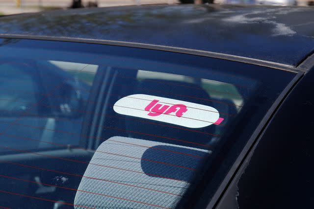 <p>Getty</p> Car for hire with a Lyft sticker.