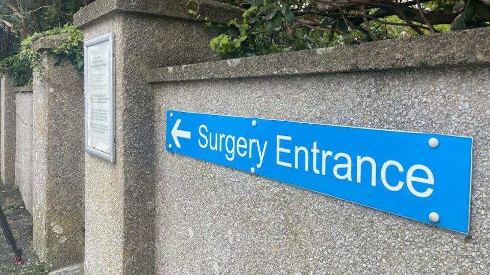Sign at front entrance of surgery