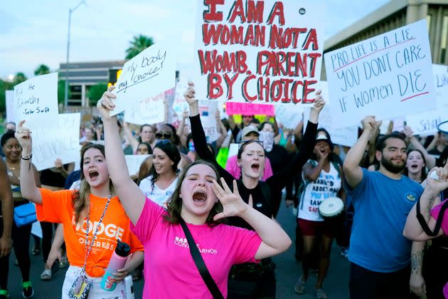 Protesters march around the Arizona Capitol in Phoenix after the U.S. Supreme Court decision to overturn Roe v. Wade on June 24, 2022. The court will hear oral arguments Wednesday on emergency care in states with abortion bans. 