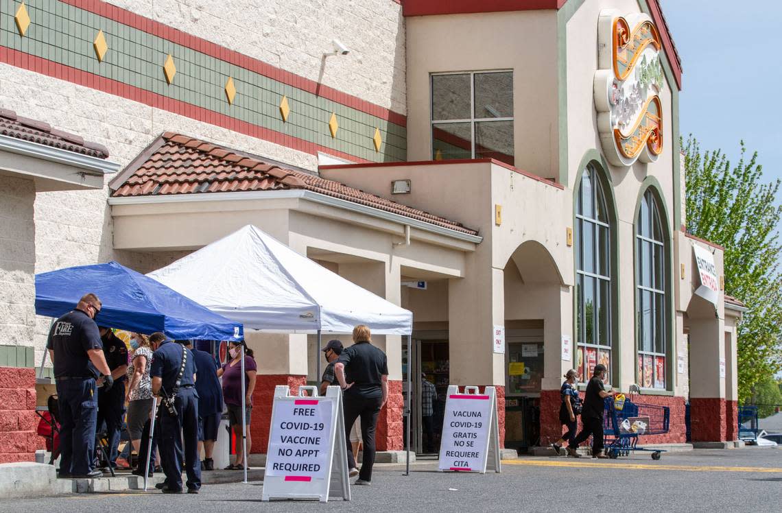 The University of Washington’s Latino Center for Health is studying the impact of long COVID in the state’s Hispanic population. Shown is a 2021 COVID-19 vaccine clinic at Fiesta Foods in Pasco.