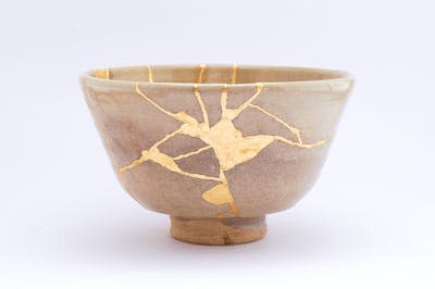 A bowl restored with gold along the cracks, using the traditional ‘kintsugi’ restoration technique. <a href="https://www.gettyimages.com/detail/photo/antique-broken-japanese-beige-bowl-repaired-with-royalty-free-image/1280370725?phrase=kintsugi&adppopup=true" rel="nofollow noopener" target="_blank" data-ylk="slk:Marco Montalti/iStock via Getty Images Plus;elm:context_link;itc:0;sec:content-canvas" class="link ">Marco Montalti/iStock via Getty Images Plus</a>