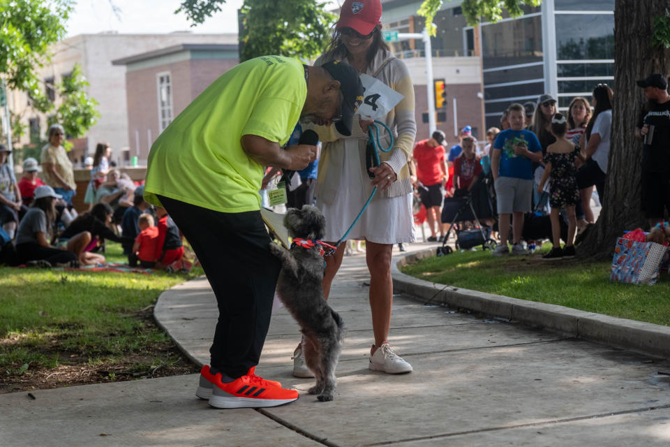 A four legged contestant seeks to curry favor with David Lovejoy at Center City's 3rd annual Patriotic Pet Parade Saturday at the Amarillo Community Market in downtown Amarillo.