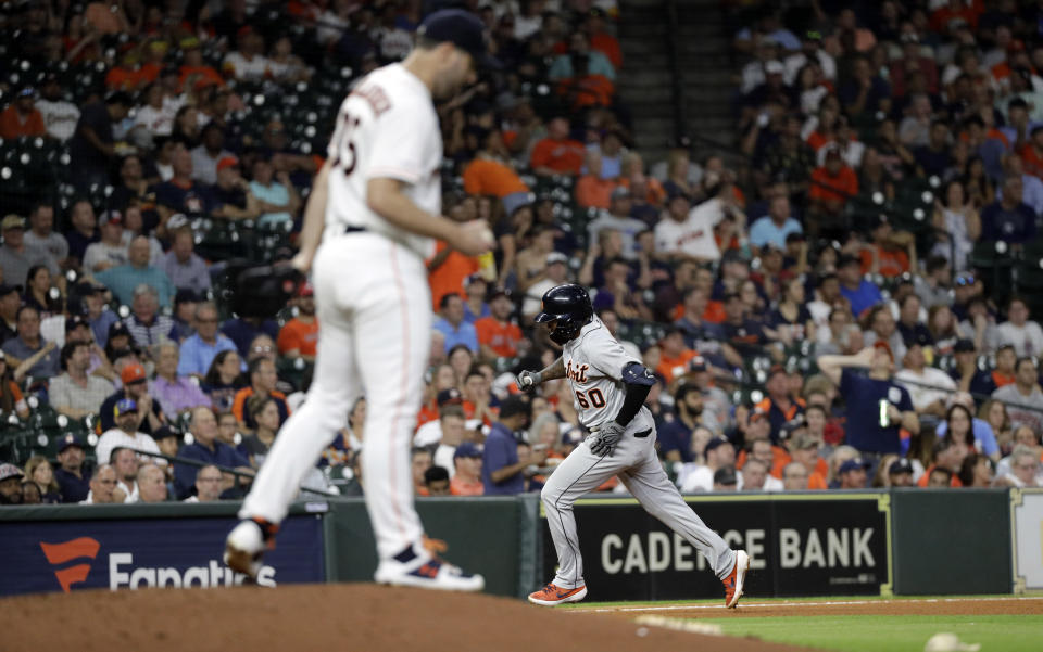 Detroit Tigers' Ronny Rodriguez (60) runs the bases after hitting a home run off Houston Astros starting pitcher Justin Verlander, left, during the fifth inning of a baseball game Wednesday, Aug. 21, 2019, in Houston. (AP Photo/David J. Phillip)